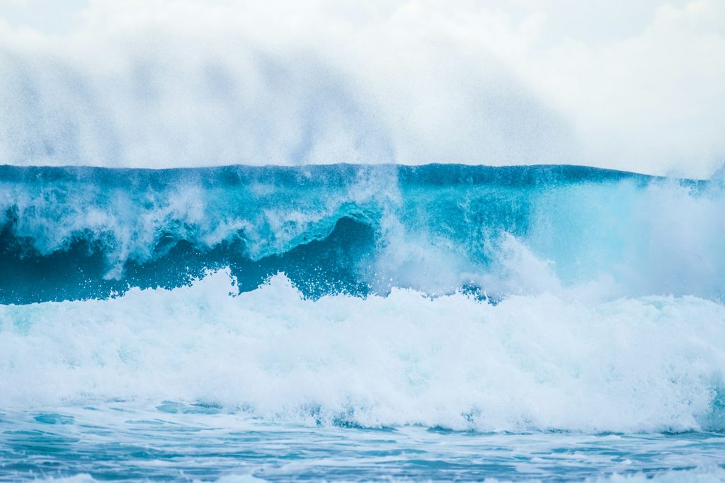 Beautiful Tropical Island Paradise Photo of Clear Aqua Blue Ocean Wave Crashing